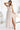 Numoco 362-8 JUSTINE Long dress with a neckline and a tie at the back - beige with glitter-0