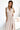 Numoco 362-8 JUSTINE Long dress with a neckline and a tie at the back - beige with glitter-1